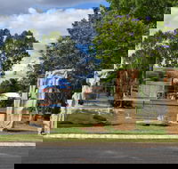 The Fossilised Forest Sculpture - Accommodation QLD
