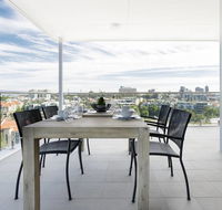 Minimalist Penthouse Condo with Skyline Vistas - Accommodation QLD