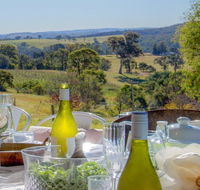 The Farmhouse - grape vines and rolling green hills - Accommodation QLD